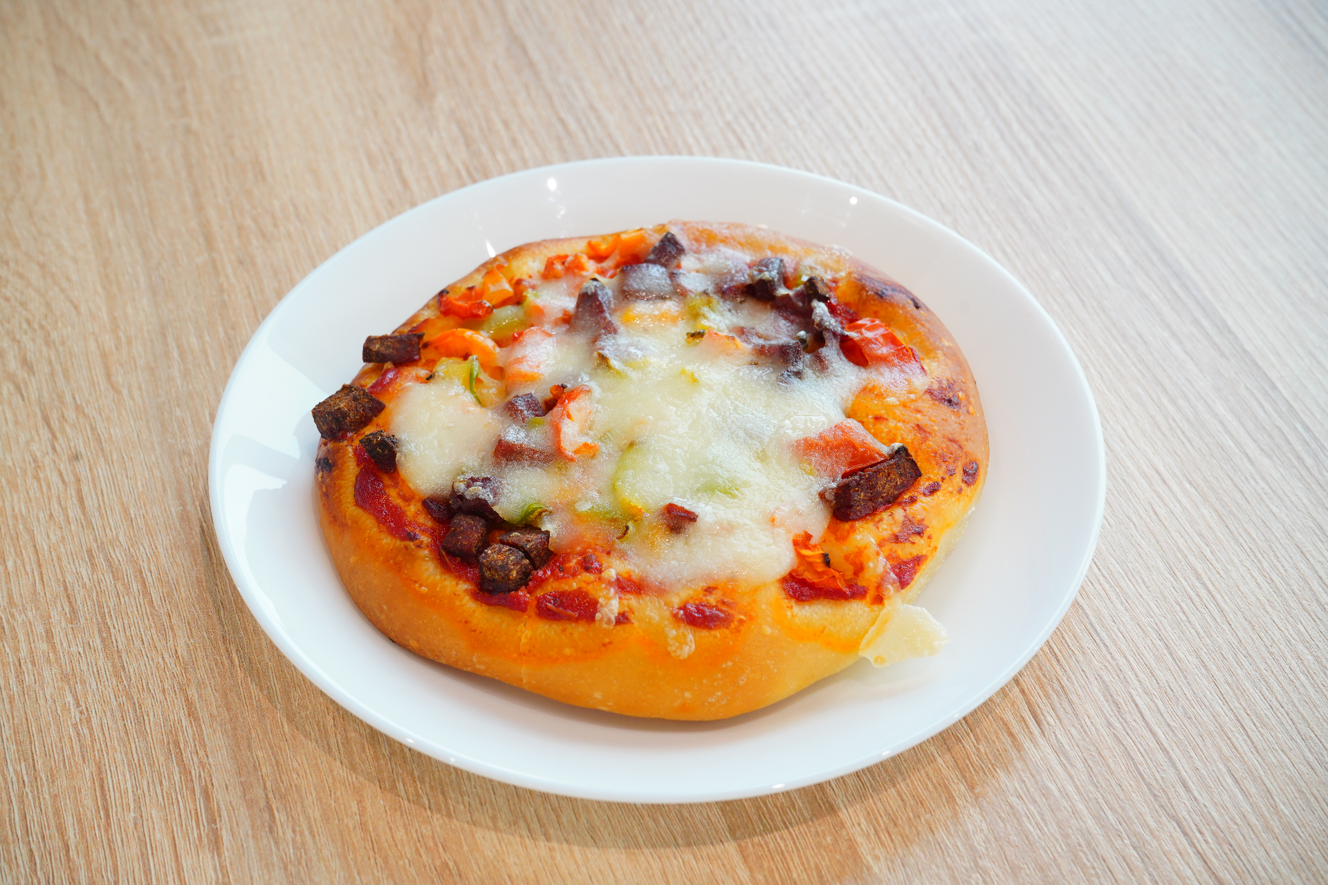 Personal pan pizza with sujuk and melted cheese