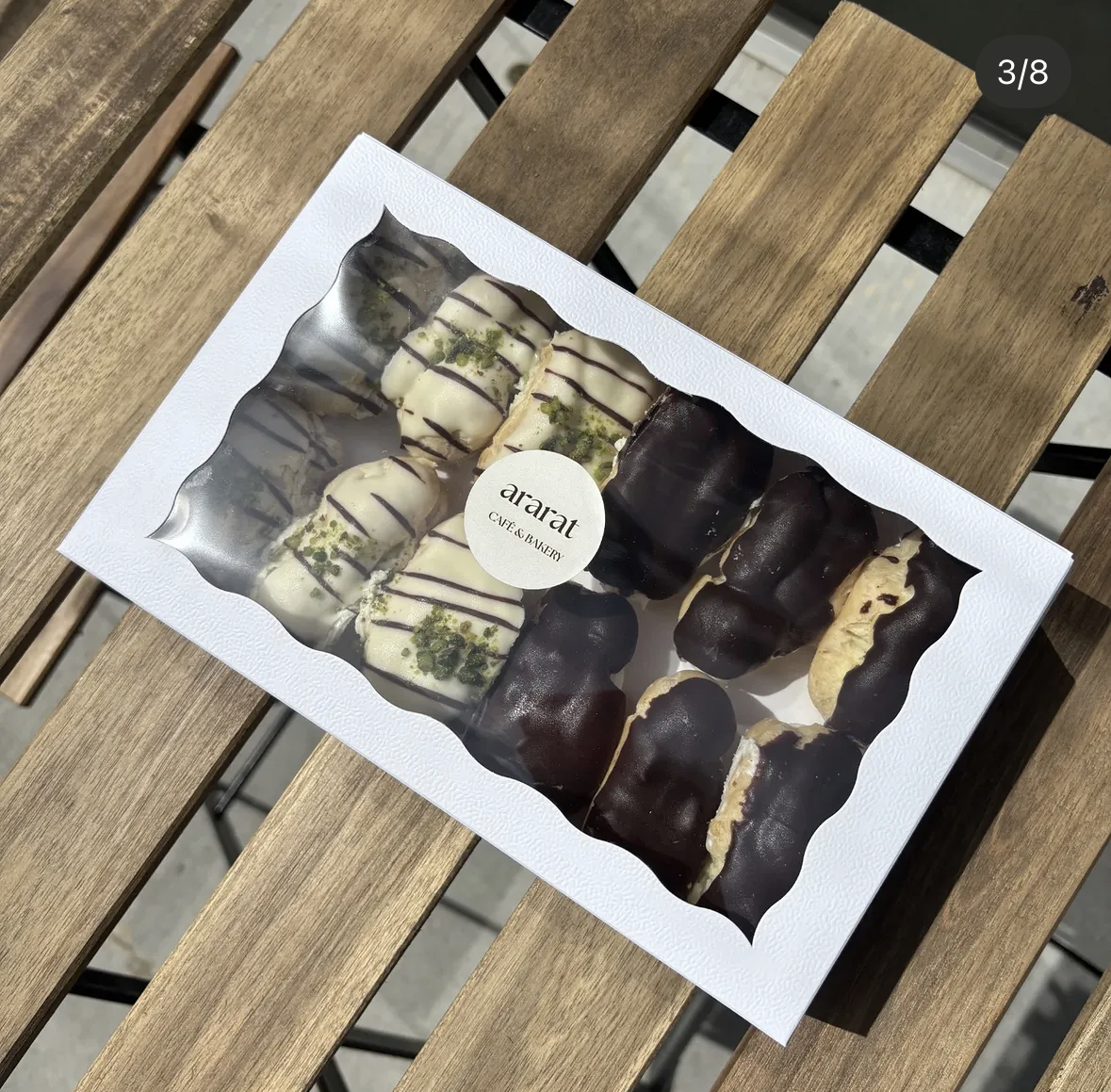 White and dark chocolate éclairs in an Ararat box