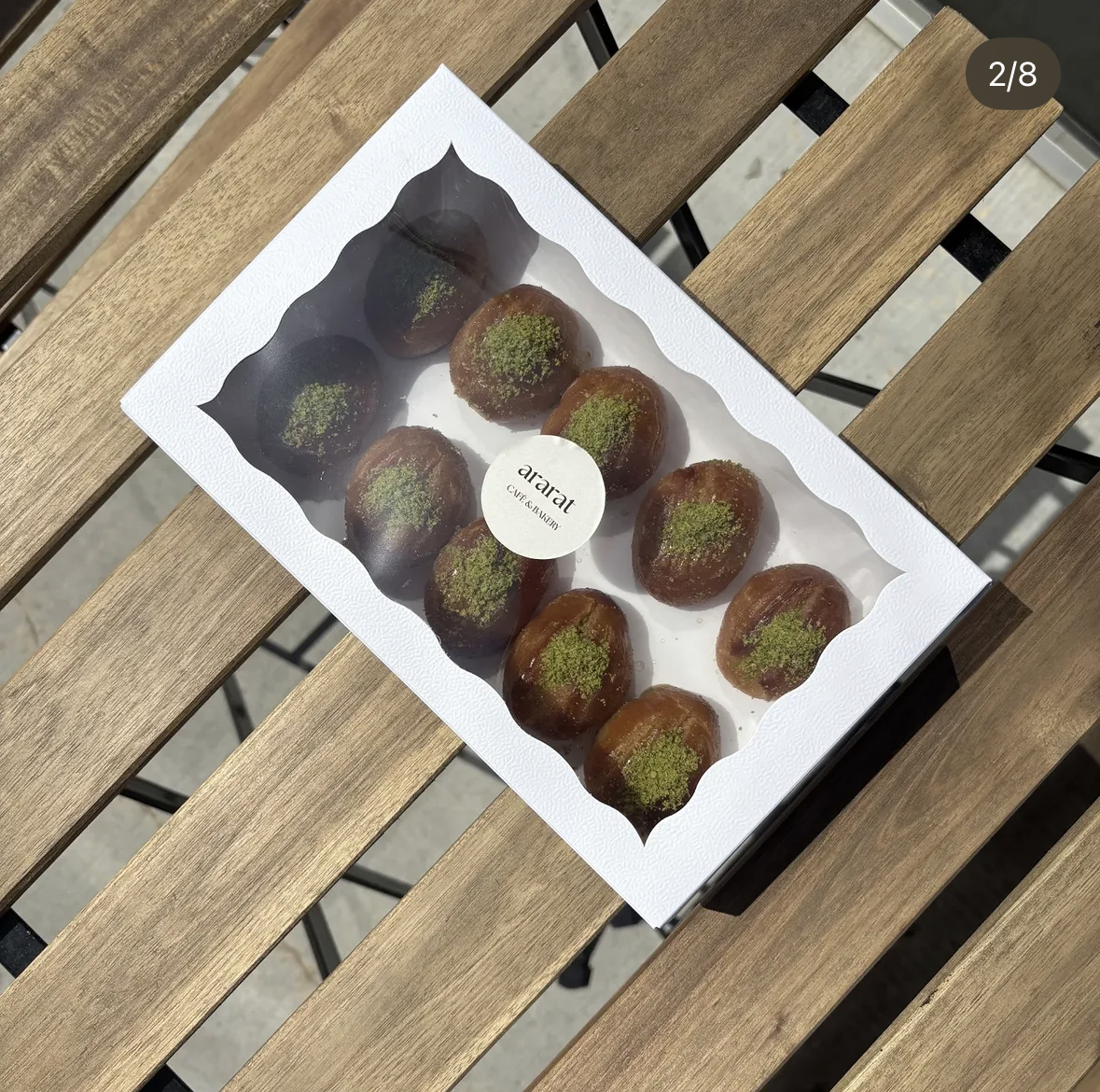 Stuffed dates dusted with pistachio in an Ararat box