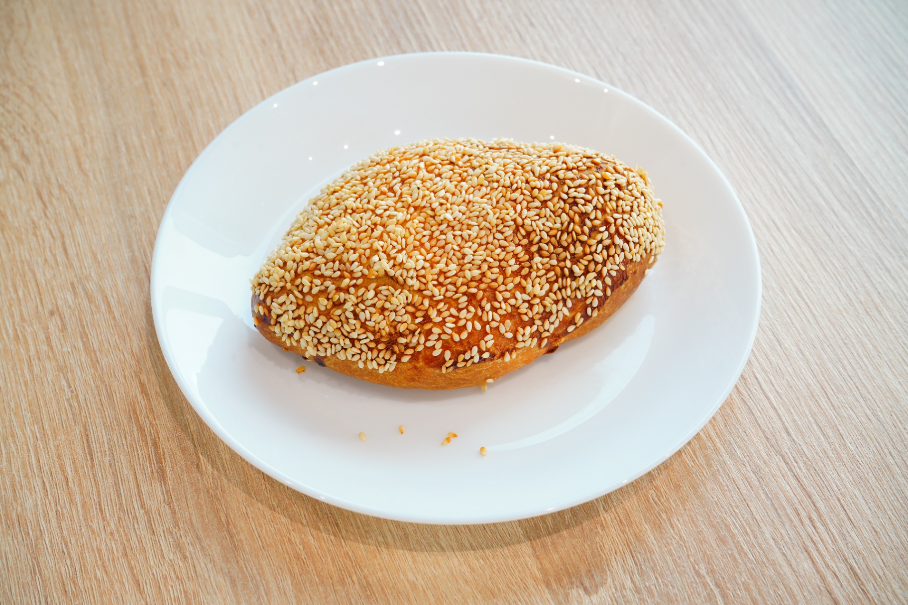 Sesame-crusted golden pastry loaf