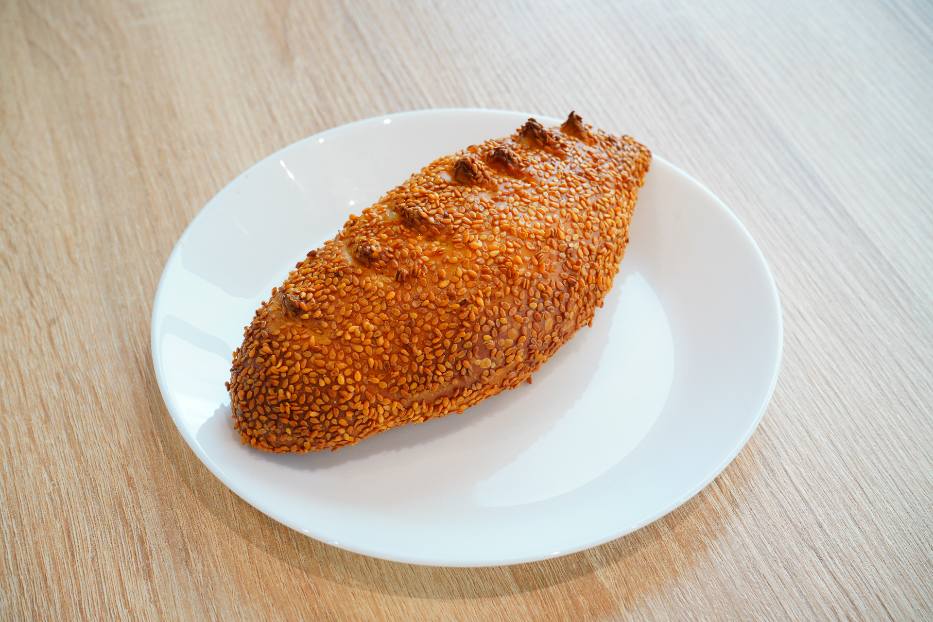 Sesame-crusted savoury filled pastry loaf